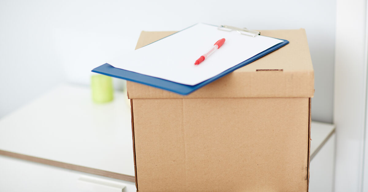 Cleaning checklist beside moving supplies