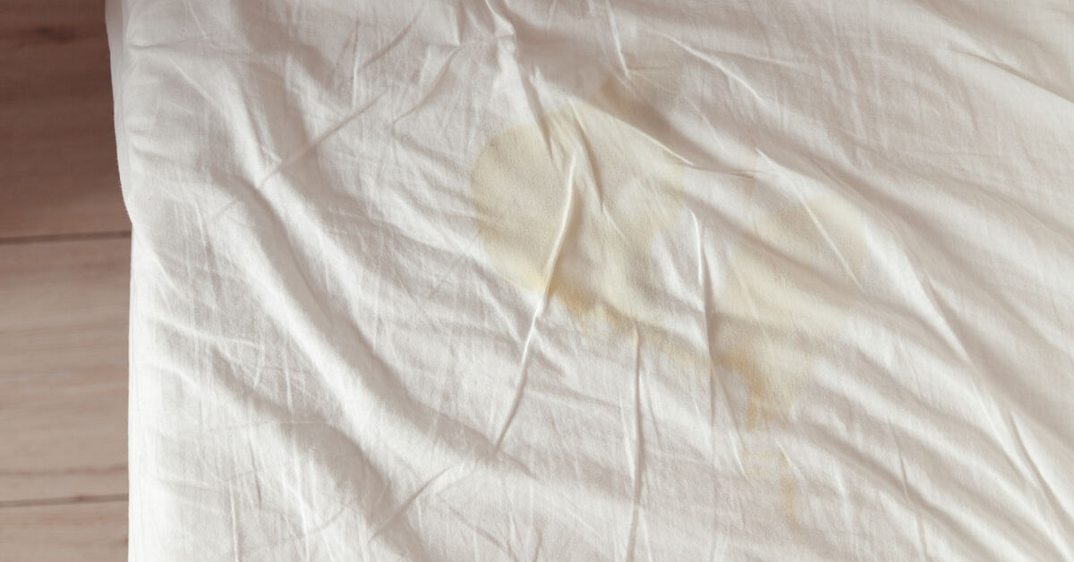 Yellow sweat stains on bed surface